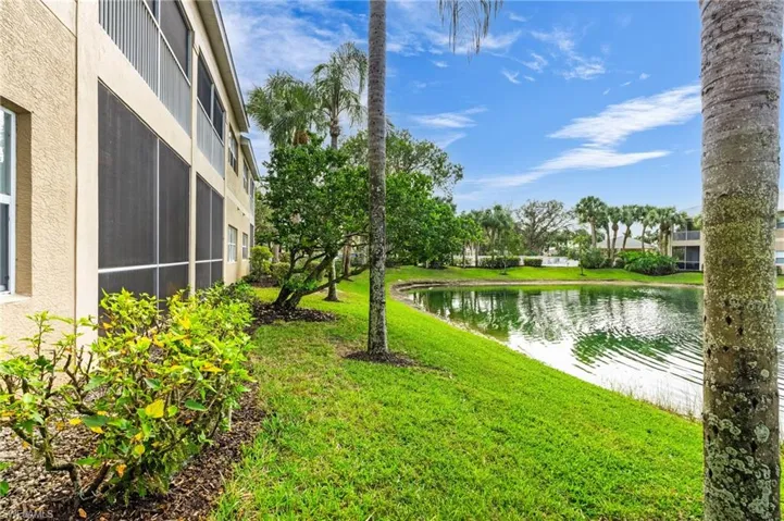 View of yard with a water view