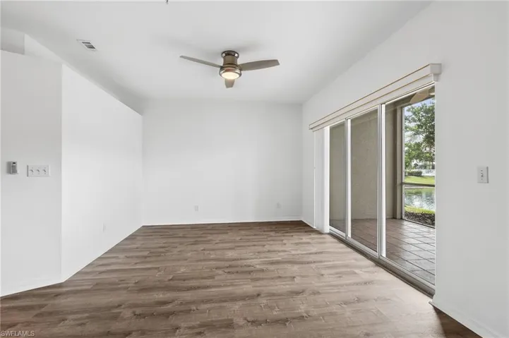 Unfurnished room featuring wood-type flooring and ceiling fan