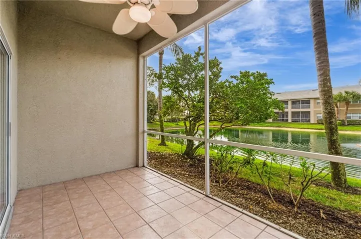 Unfurnished sunroom featuring a water view