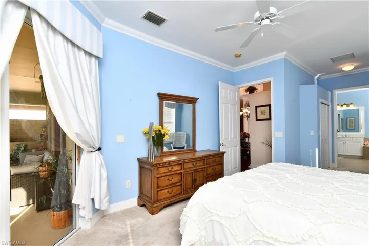 Primary bedroom with sliders looking out to lanai