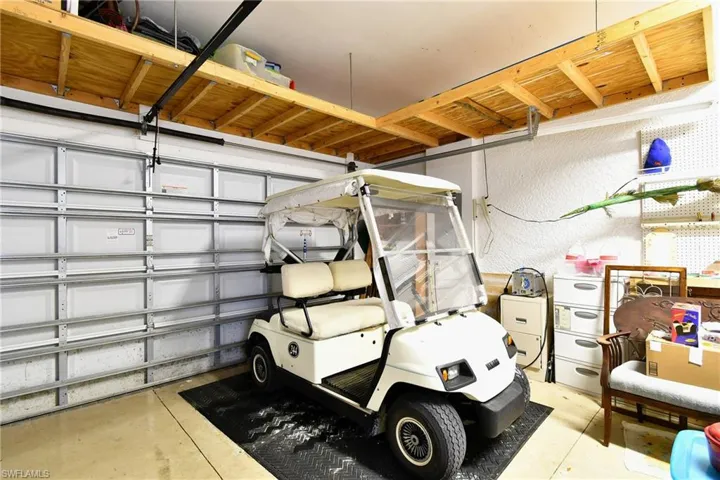 Lots of garage storage. Golf Cart conveys