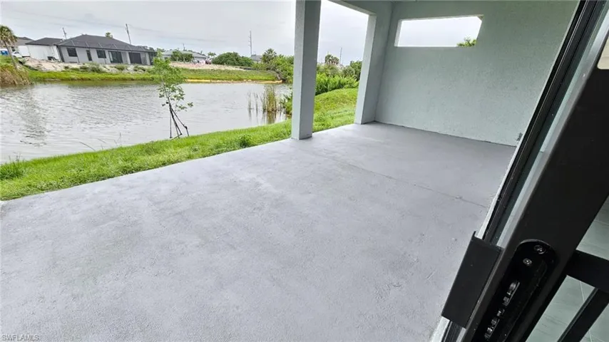 View of patio / terrace featuring a water view