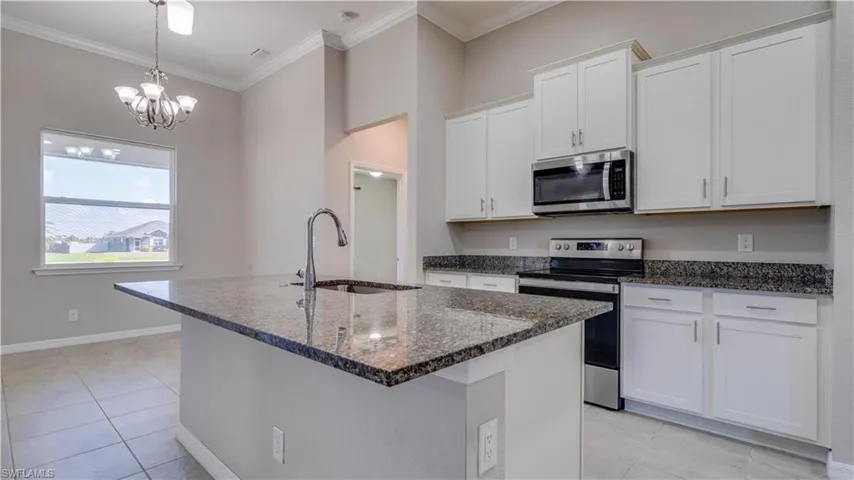 The kitchen features an island for barstools and a Breakfast Room.