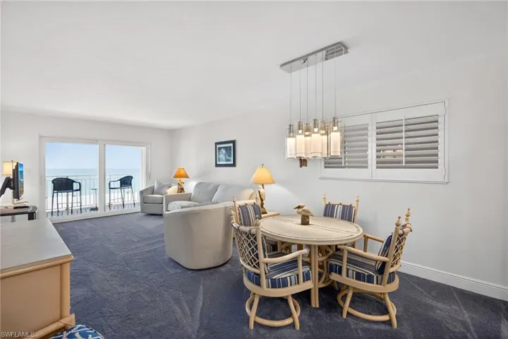 Dining room with dark carpet
