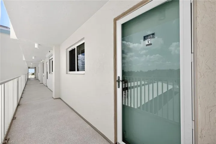 Entrance to property featuring stucco siding