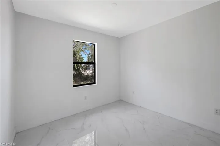 Empty room with light marble finish floors