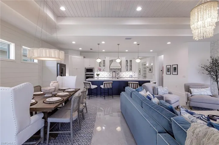 Living room featuring a notable chandelier