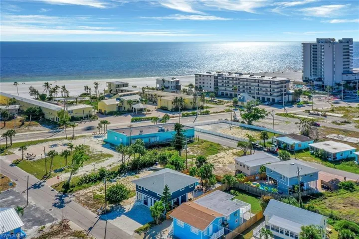 Aerial view with a beach view and a water view