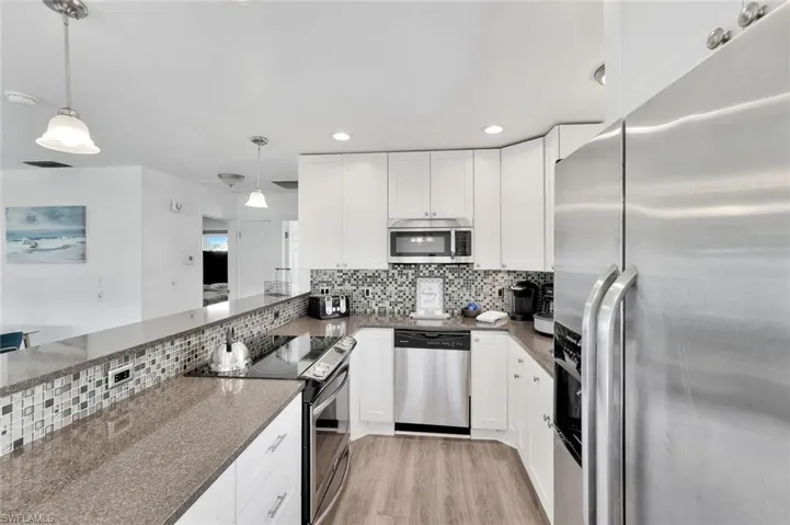 Kitchen with white cabinets,