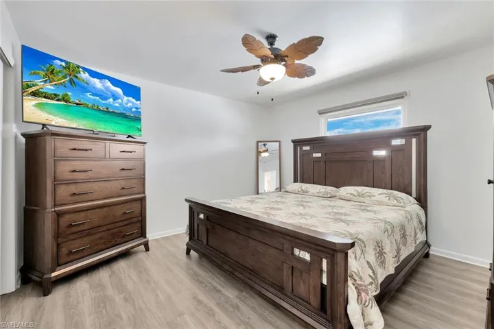 Bedroom featuring ceiling fan and light hardwood / wood-style floors