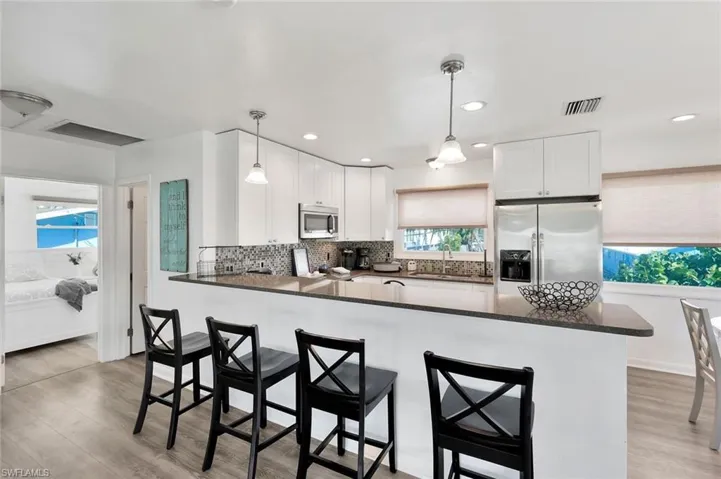 Kitchen with peninsula & stainless steel finishes