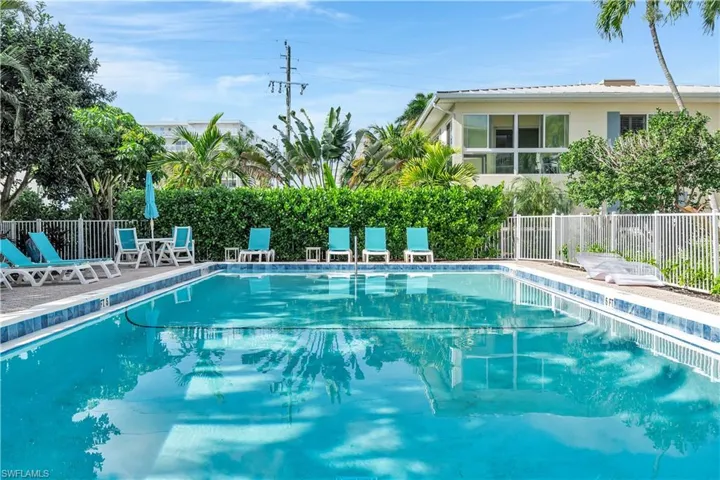 Community pool featuring a patio