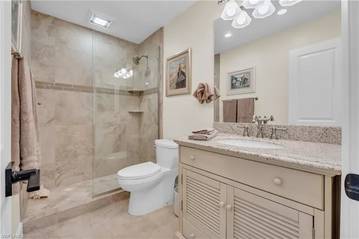 Bathroom with vanity and a shower stall