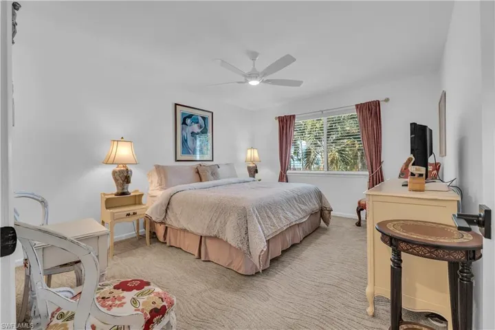 Bedroom with carpet flooring and ceiling fan