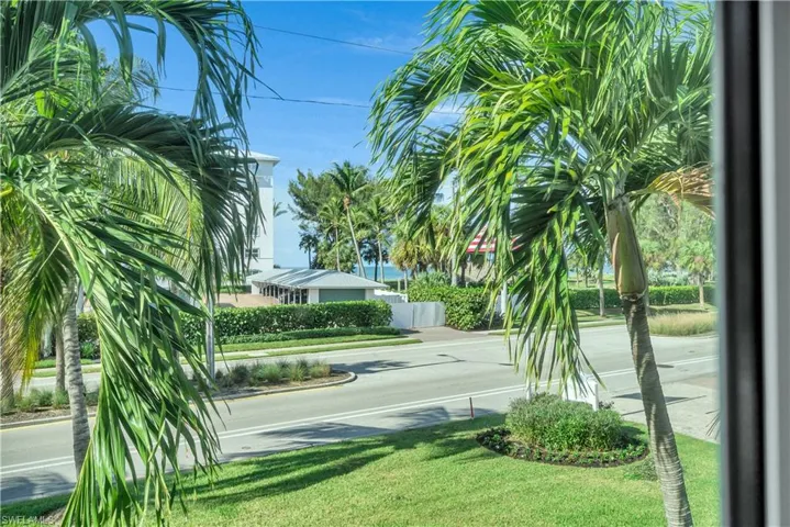 View of asphalt street featuring curbs