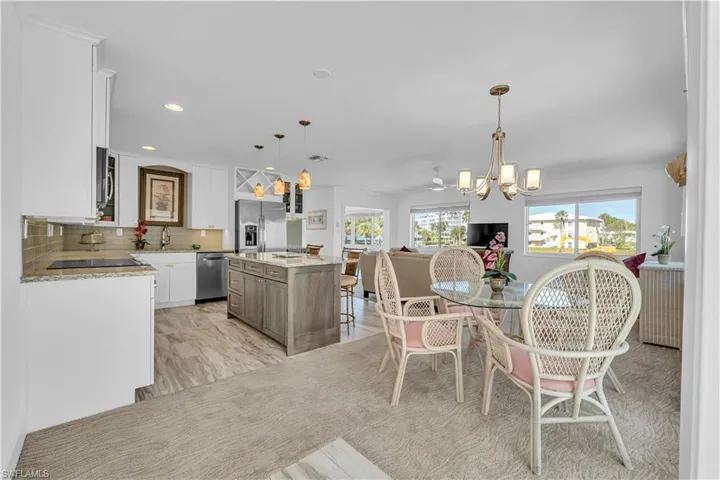 Dining area featuring a chandelier and recessed lighting