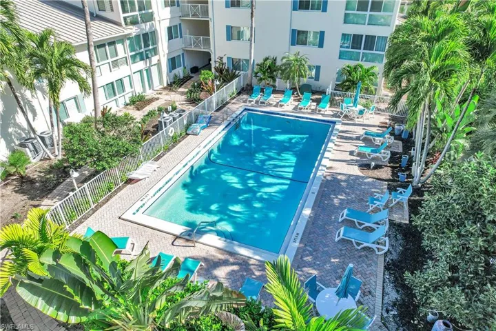 Community pool with a patio