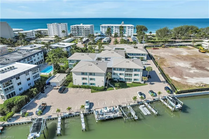 Bird's eye view of a large body of water and apartment complex / building