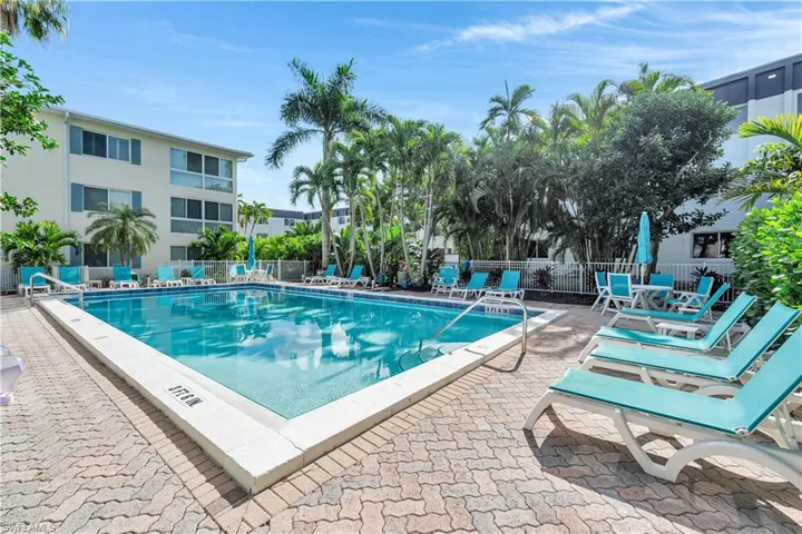 Community pool with a patio