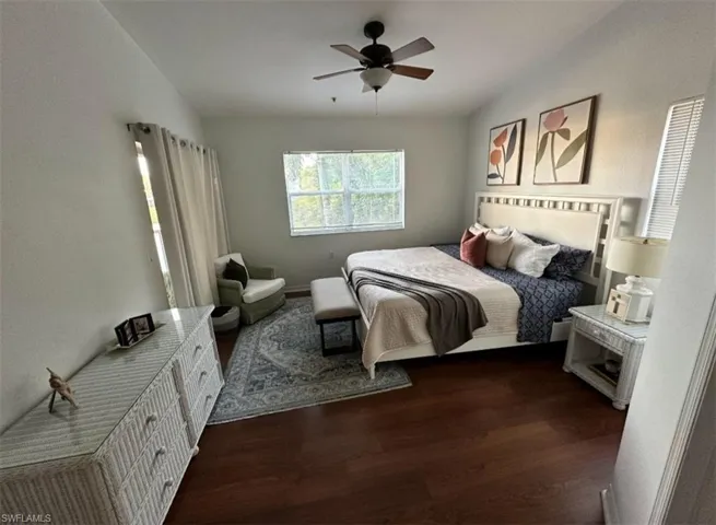 Bedroom featuring dark wood finished floors and ceiling fan