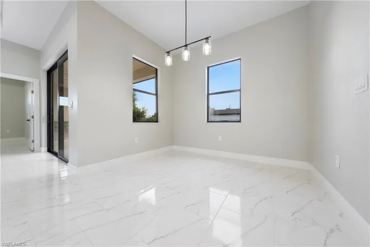 Empty room with light marble finish flooring and baseboards