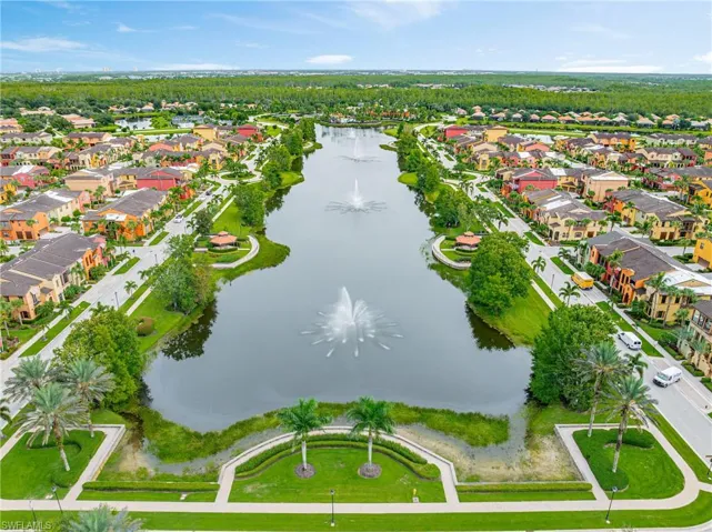 View of property location featuring a large body of water and nearby suburban area