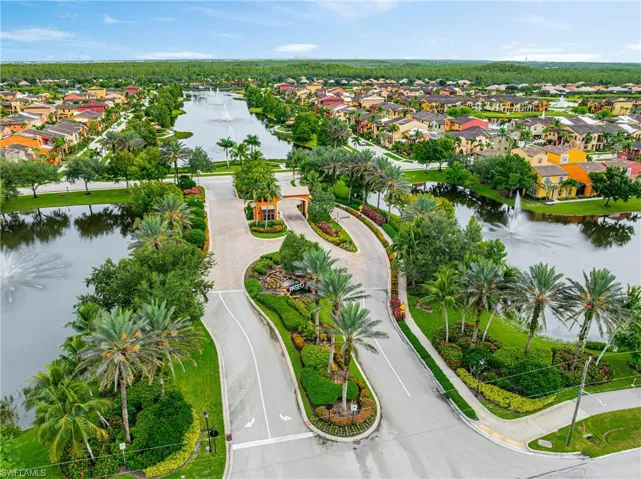 Aerial view of residential area featuring a large body of water
