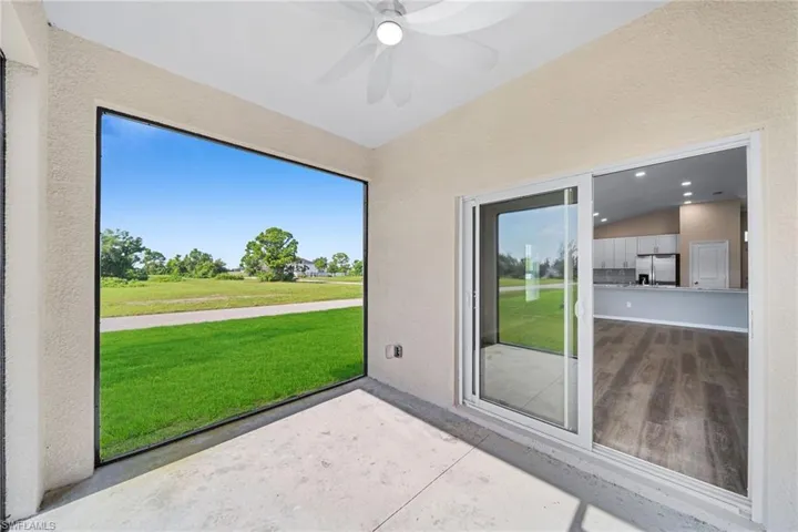 Sunroom featuring vaulted ceiling and ceiling fan