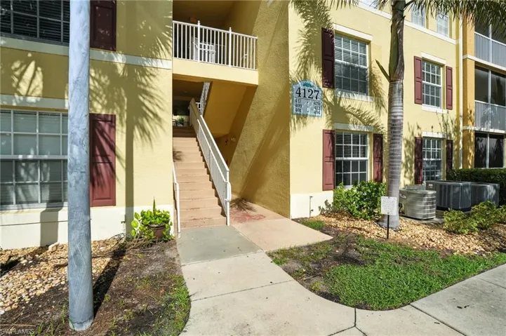 View of apartment building / complex featuring stairway