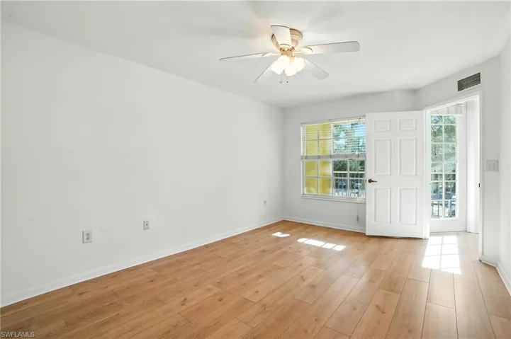 Spare room featuring light wood-style floors and a ceiling fan