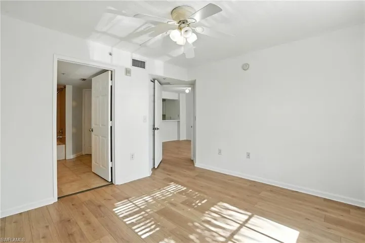 Unfurnished bedroom with light wood-type flooring and a ceiling fan