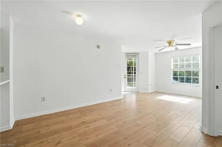 Spare room featuring light wood-style floors and a ceiling fan