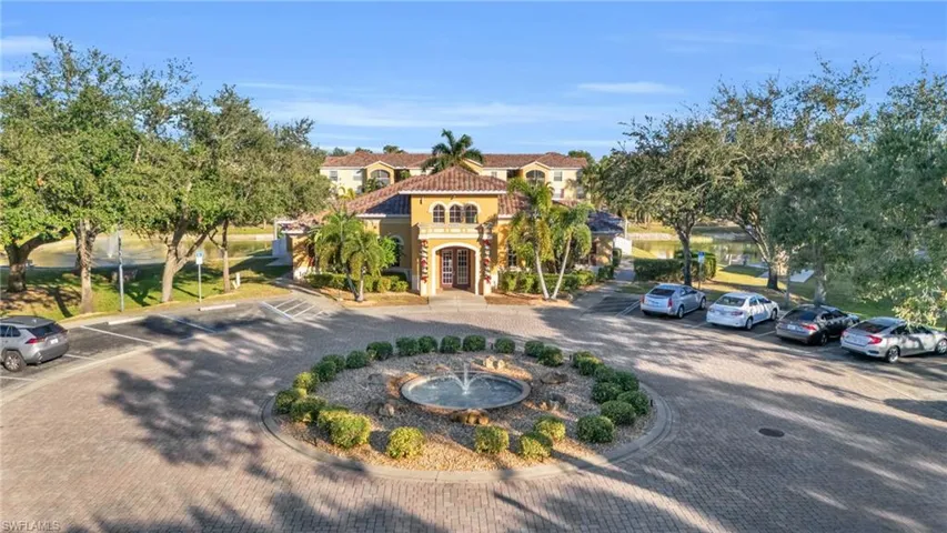Mediterranean / spanish-style home with french doors, stucco siding, and uncovered parking