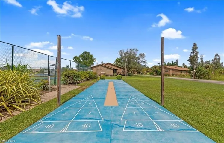 Shuffleboard court on blue-finished hardscaping