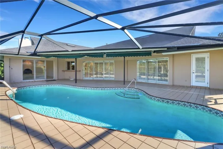 Outdoor pool with a patio