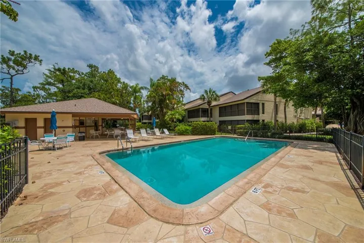 Community pool featuring a patio area
