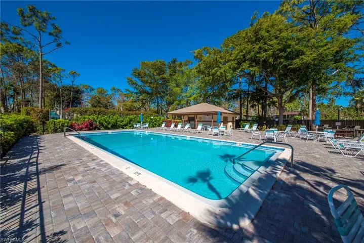 Community pool featuring a patio area