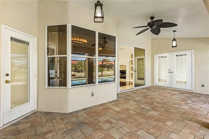 View of patio / terrace featuring french doors and ceiling fan