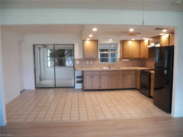 Dining area with sliders to the Florida room and pool