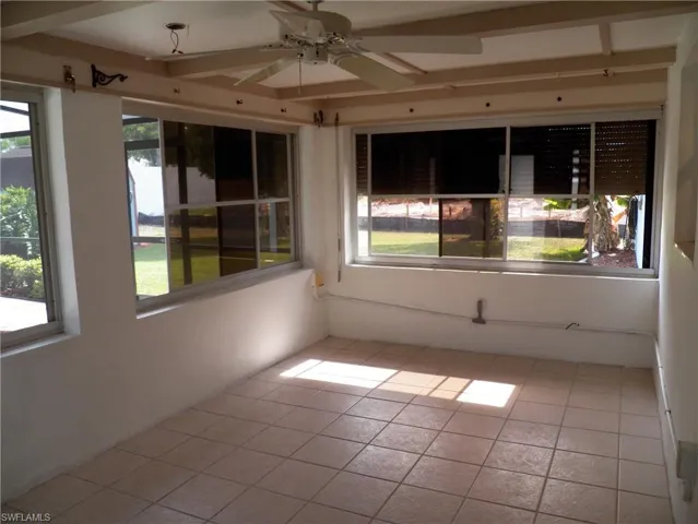 Florida room, tile floor, rolldown shutters