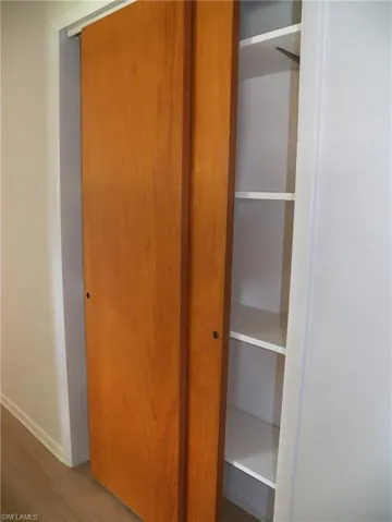 Hall closet with shelves