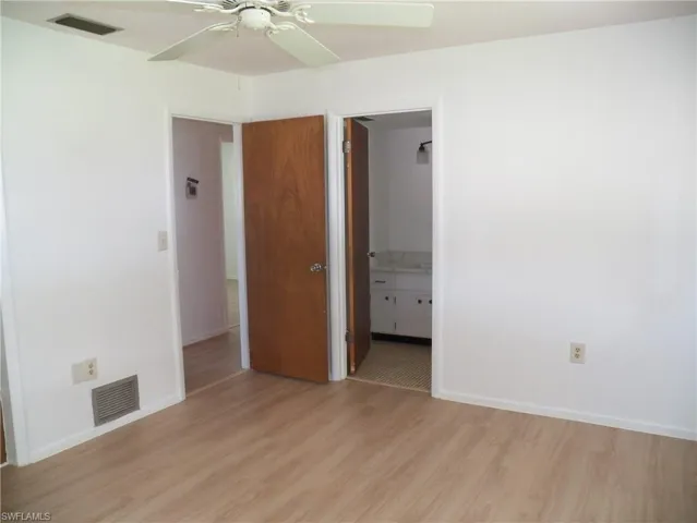 Primary bath door from the primary bedroom
