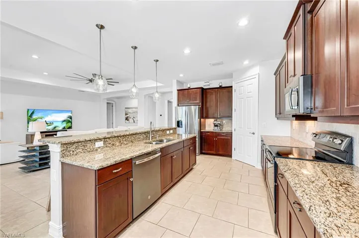 Living room and kitchen are open to one another.