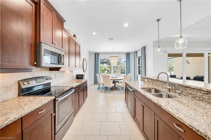 So much cabinet and counter space in this LARGE kitchen -- plenty of room for at least two chefs!...