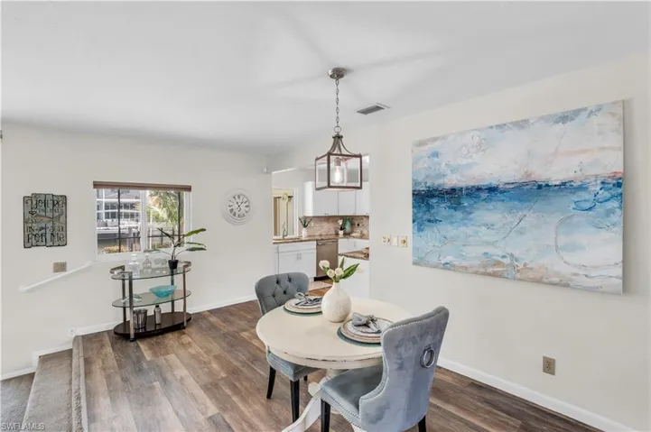 Dining space featuring hardwood / wood-style floors and a chandelier