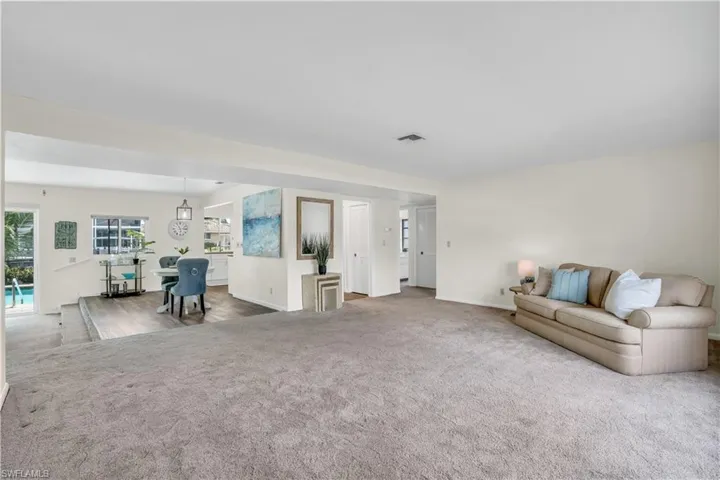 Unfurnished living room featuring carpet floors