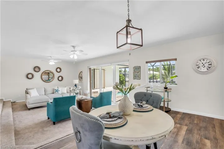 Dining space featuring wood-type flooring and ceiling fan