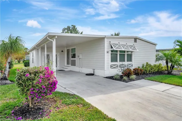 View of front of home with a carport