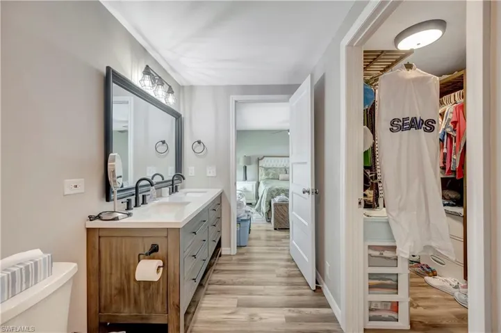 Bathroom with vanity and hardwood / wood-style flooring