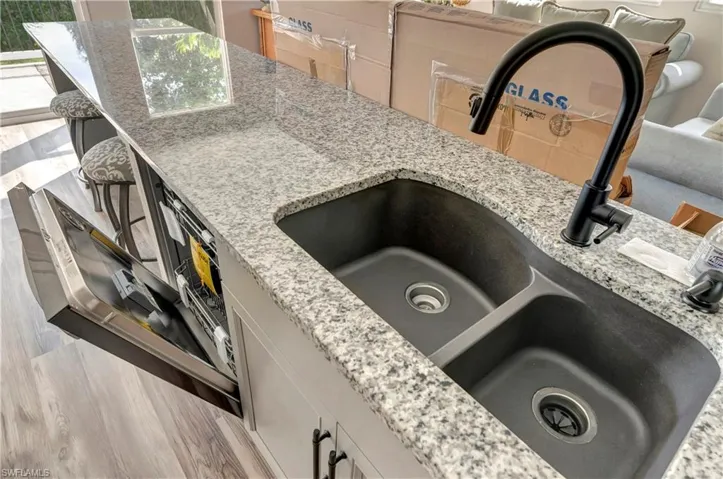 Interior details with light granite stone countertops and sink